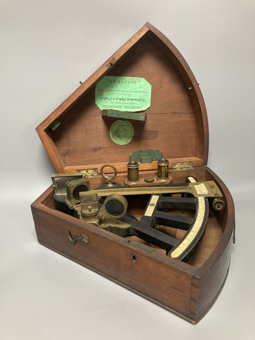 A 19th century ebony and brass octant by Crichton Bros, Billiter St, London, with ivory scale